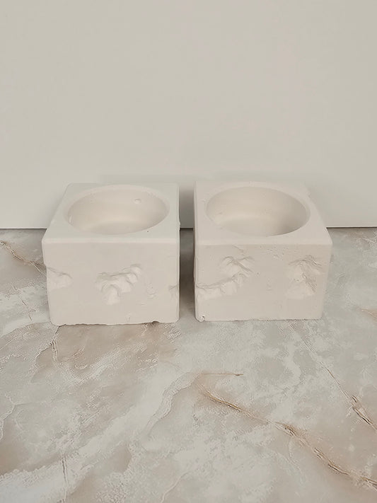 Two terrazzo stone-look cube candlesticks side by side on a marble surface, handmade home decor by Gifts LA