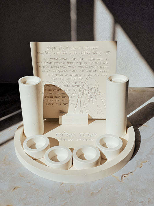 Handmade Baba Sali round Shabbat candle set with natural stone look candle holders on a circular tray