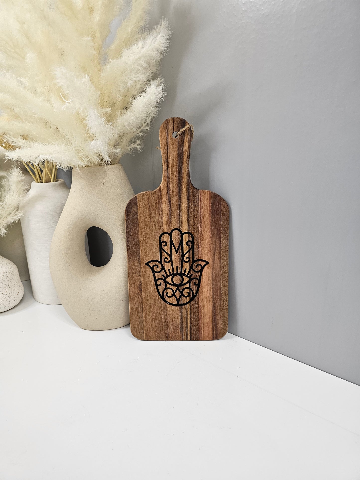 Custom hamsa design wood cutting board with personalized engraving